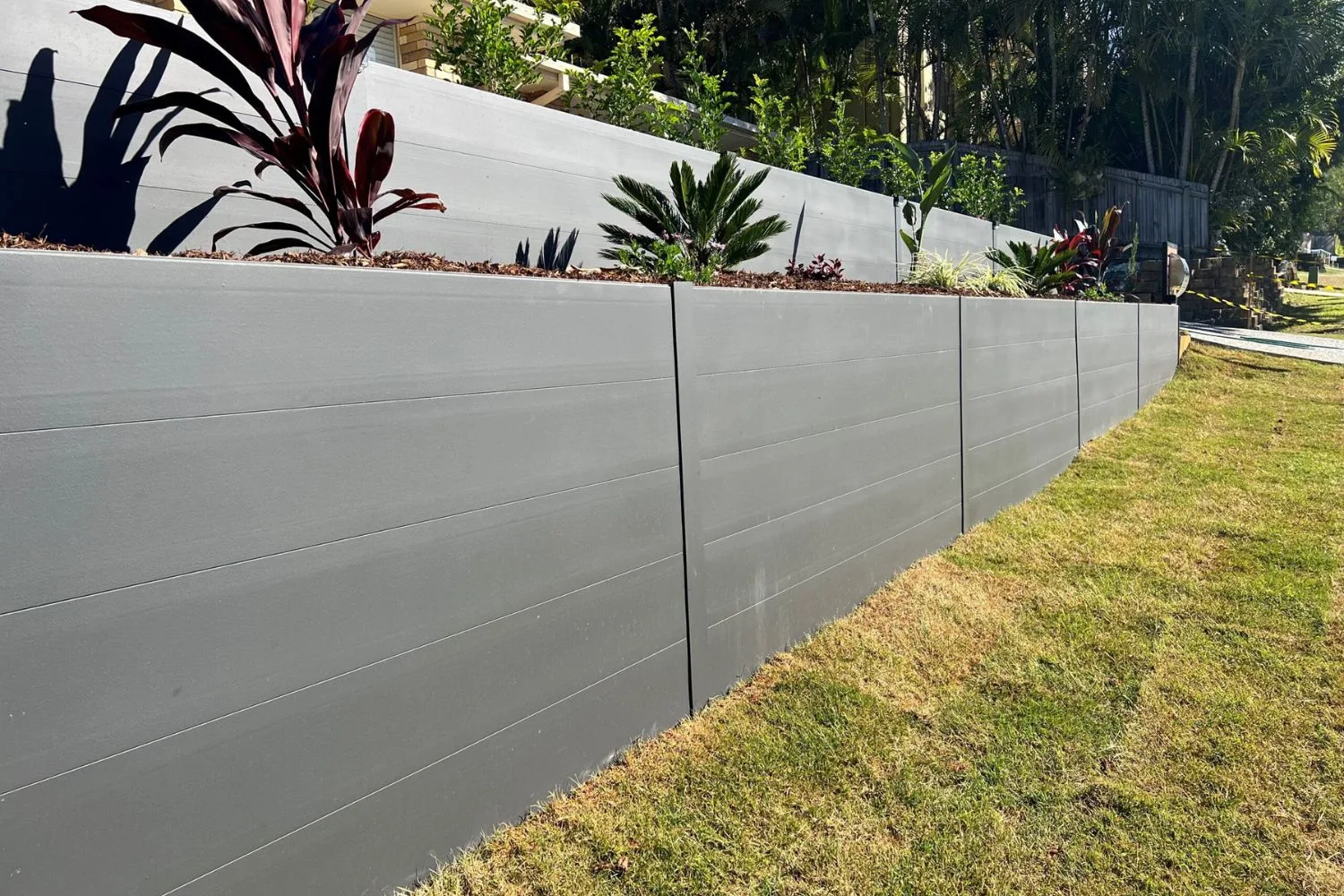Concrete retaining wall construction